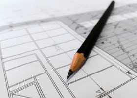pexels-photo-268362-268362 Detailed image of a black pencil resting on architectural blueprints, ideal for design and planning themes.